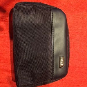 Black nylon Tumi cosmetic bag